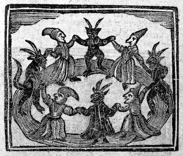Witches dancing with devils from the History of Wizards and Witches 1720